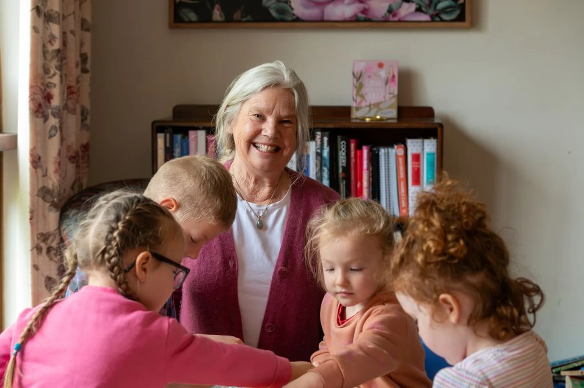 Woman smiling with kids doing fun activities