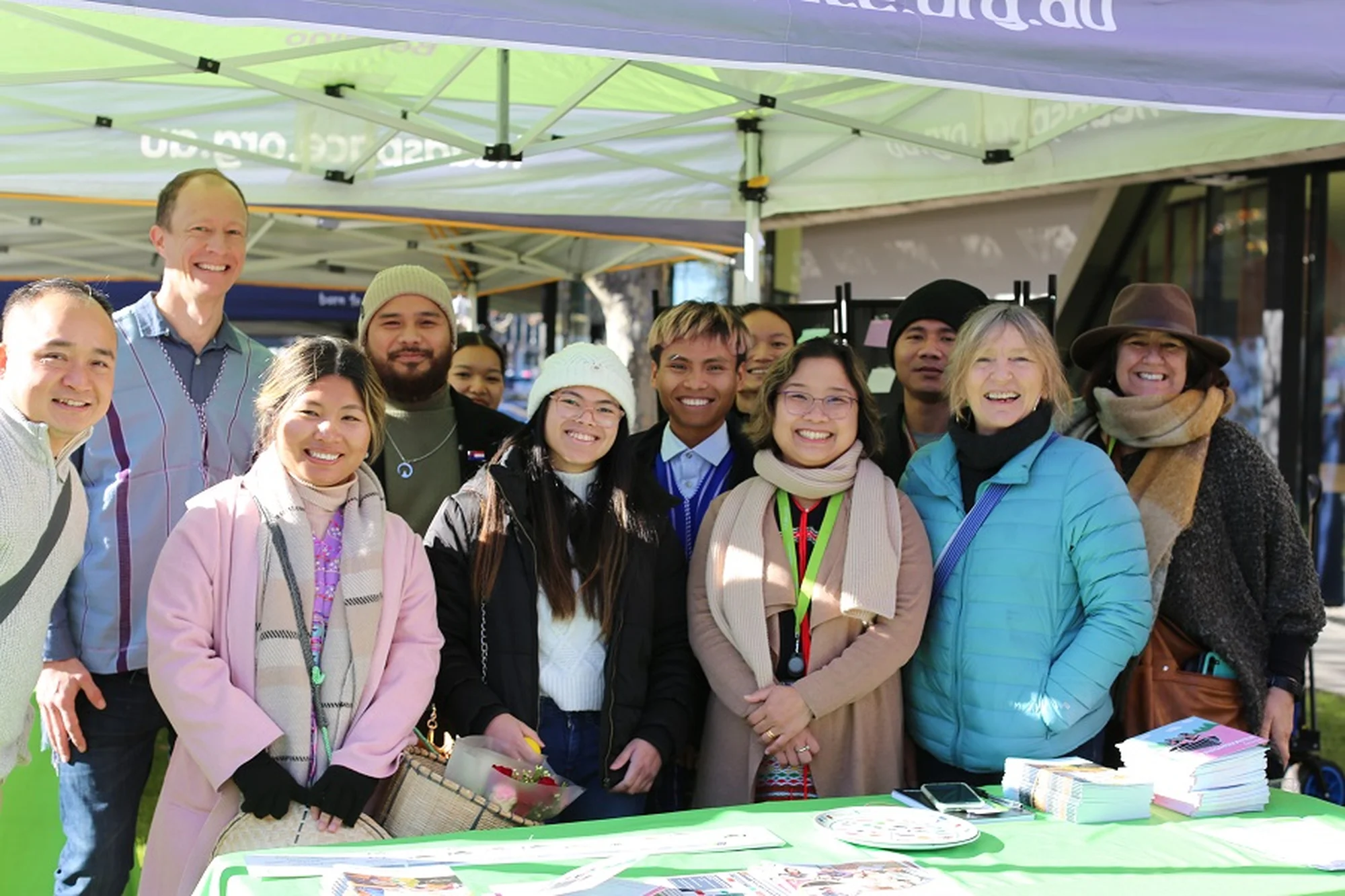 Settlement services team in a marquee