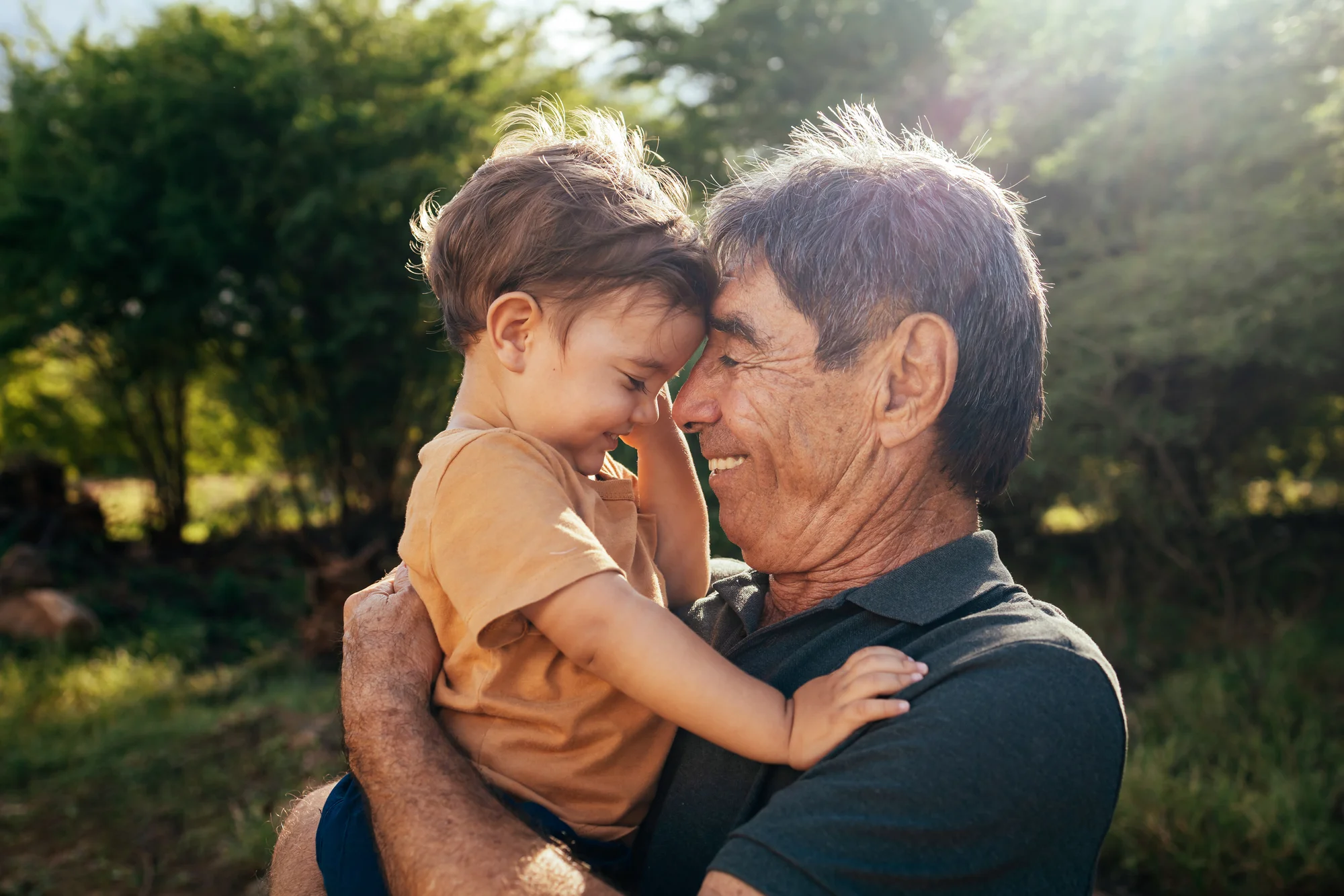 Man hugging his son and smiling